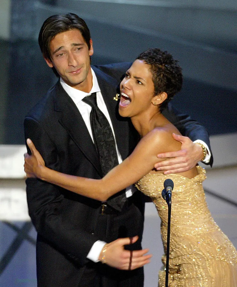 Adrien Brody kisses Halle Berry during the 75th Academy Awards at the Kodak Theatre in Hollywood, California, March, 23, 2003. | Source: Getty Images